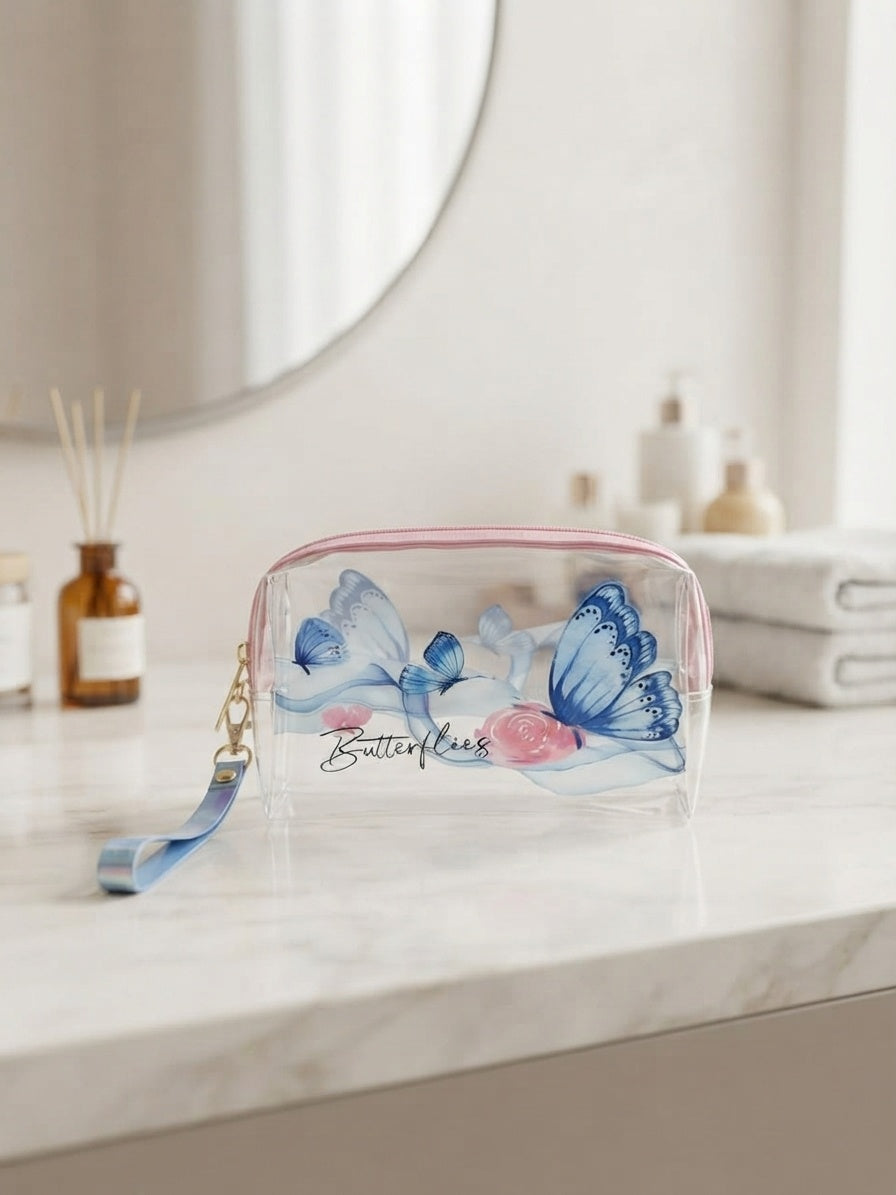 Transparent cosmetic bag with blue butterflies and floral print, front zipper and wrist strap